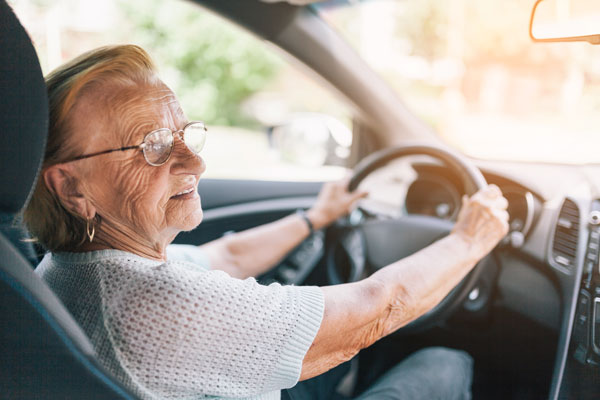 Elderly woman behind a steering wheel - No Dementia Seen