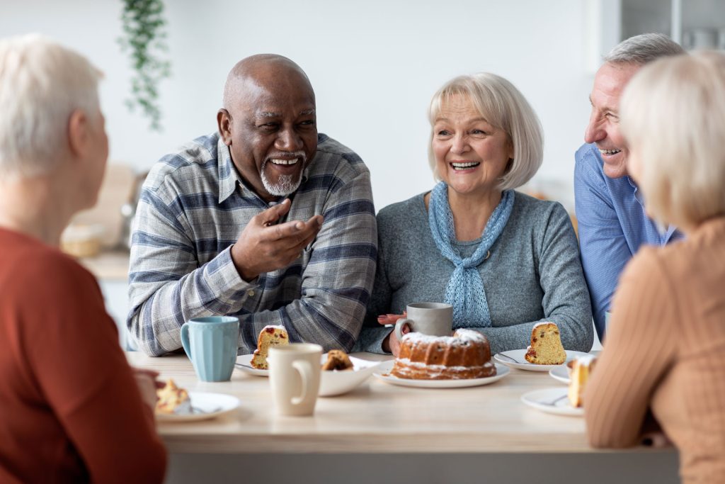 group-of-positive-elderly-people Older adults enjoying a conversation together